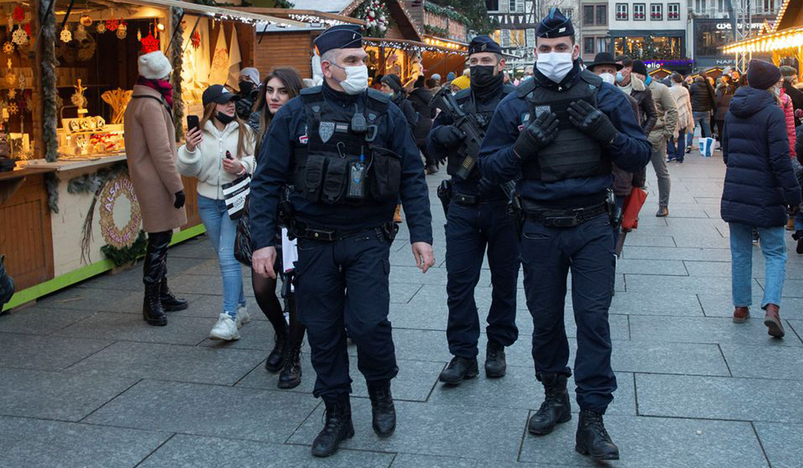 French police officers patrol at a Christmas market